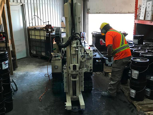 Forage pour &eacute;valuation environnementale de site phase II - possible contamination dans un garage.